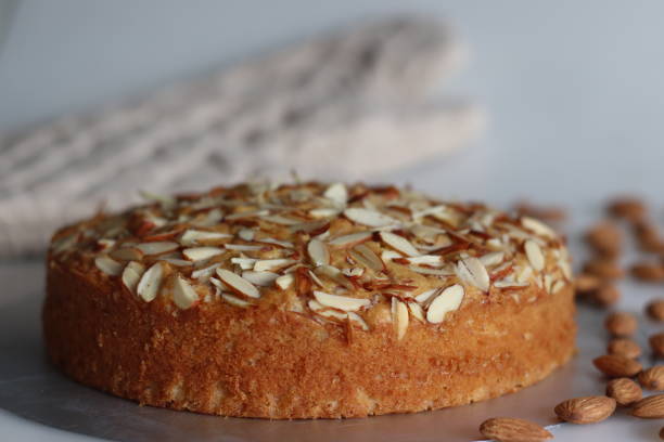Almond buttermilk cake. A delicious cake adorned with a generous sprinkle of chopped almonds, perfect for tea time. Easy-to-make and visually appealing. Tempting treat for any occasion